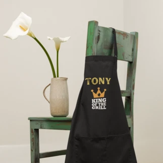  Personalized apron with Tony's first name and King of the grill printed on it.